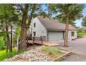 Exterior view of a home's entrance, with a ramp and rock landscaping at 1129 Genesee Vista Rd, Golden, CO 80401