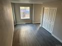 Living room featuring hardwood floors, a window, and a closet at 1642 N Lafayette St # 5, Denver, CO 80218