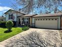 A well kept single Gathering home with tidy landscaping and a two car garage at 12622 W Radcliff Ave, Morrison, CO 80465
