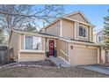 Charming two-story home with a well-manicured front yard, two-car garage, and inviting entryway at 2488 W 111Th Pl, Denver, CO 80234