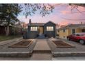 Charming home featuring a landscaped front yard, brick facade, and inviting entryway at 1445 Ash St, Denver, CO 80220