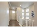 Inviting entryway with hardwood floors, a staircase, and lots of natural light at 3336 Goodyear St, Castle Rock, CO 80109
