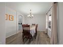 Formal dining room with hardwood floors and chandelier at 3929 S Quemoy Ct, Aurora, CO 80018