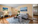 Bright living room featuring hardwood floors and comfy seating at 3045 Xanadu St, Aurora, CO 80011