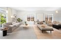 Bright living room featuring modern furniture, hardwood floors, and natural light at 19 S Eudora St, Denver, CO 80246