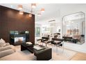 Comfortable living area with fireplace, modern lighting, and open floor plan at 19 S Eudora St, Denver, CO 80246