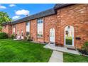 Charming brick townhomes with well-manicured lawns and inviting front entrances at 4445 S Lowell Blvd, Denver, CO 80236