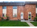 Charming brick townhomes with well-manicured lawns and inviting front entrances at 4445 S Lowell Blvd, Denver, CO 80236