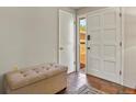 Inviting entryway with a tiled floor, a cushioned bench, and a bright white front door at 455 Greenwood, Longmont, CO 80504