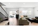 Bright living room with sliding glass doors leading to a backyard at 6780 Meade Cir # B, Westminster, CO 80030