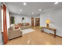 Spacious living room featuring neutral decor, wood floors, and abundant natural light at 6769 W 70Th Ave, Arvada, CO 80003