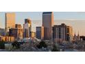 Wonderful view of the Denver skyline from this apartment listing with tall buildings and the rocky mountains in the background at 800 N Washington St # 710, Denver, CO 80203