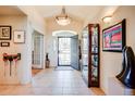 Spacious foyer with tile flooring, elegant lighting, and access to other rooms in the home at 12 Canon Cir, Greenwood Village, CO 80111