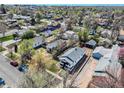 Aerial view of a neighborhood showcasing a home with a new roof and fenced backyard at 45 S Grove St, Denver, CO 80219