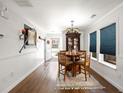 Dining room with wood floors, round table with chairs, and a china cabinet at 2320 Morningview Ln, Castle Rock, CO 80109