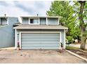 Two-story home with an attached two-car garage painted in a modern color scheme at 2773 S Lansing Way, Aurora, CO 80014