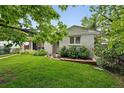 Charming single-story home with a well-manicured lawn, mature trees, and tasteful landscaping in front at 11 S Albion St, Denver, CO 80246