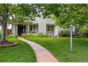 Inviting home with lush front lawn and decorative sidewalk at 11 S Albion St, Denver, CO 80246