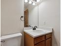 Cozy half-bath featuring a pedestal sink and neutral decor at 13457 Glen Cir, Broomfield, CO 80020