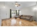 Inviting living room with hardwood floors, large windows, and comfortable seating area at 2659 S Halifax St, Aurora, CO 80013