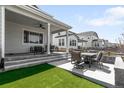 Outdoor living space with comfortable seating and an outdoor dining set at 777 Gold Hill Dr, Erie, CO 80516