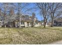 Beautiful home with a large front yard and mature trees at 2 Elm St, Denver, CO 80220
