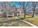 Spacious home with a long walkway leading to the entrance at 2 Elm St, Denver, CO 80220