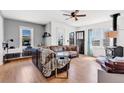 Inviting living room with a wood-burning stove, hardwood floors, comfortable seating, and natural light at 15205 W 43Rd Ave, Golden, CO 80403