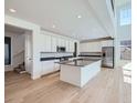 Contemporary kitchen with stainless appliances, island, and an open layout at 4652 Windmill Dr, Brighton, CO 80601