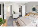 Cozy bedroom features a comfortable queen-sized bed and ample closet space at 2875 S Espana Ct, Aurora, CO 80013