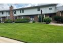 Charming townhomes with brick facades, well-maintained lawns, and mature landscaping at 10320 E Jewell Ave # 63, Aurora, CO 80247