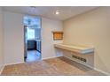 Neutral flex room with built-in desk adjacent to the kitchen area at 10320 E Jewell Ave # 63, Aurora, CO 80247