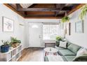 Bright and airy living room with hardwood floors, comfortable seating, and abundant natural light at 26288 S End Rd, Kittredge, CO 80457