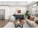 Bright and airy living room with hardwood floors and large windows at 5360 Allison St # D, Arvada, CO 80002