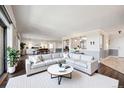 Bright living room featuring large windows, an open floor plan, and a comfortable seating arrangement at 14390 E Marina Dr # 606, Aurora, CO 80014
