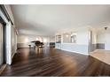 Spacious living room with hardwood floors, recessed lighting, and a pass-through to the kitchen at 14390 E Marina Dr # 606, Aurora, CO 80014