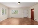 Bright living room featuring hardwood floors, natural light, and a neutral color palette at 4433 S Washington St, Englewood, CO 80113
