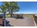 An outdoor deck is set up with seating and a hot tub, providing stunning views of the surrounding landscape at 9025 Rocky Mountain Ln, Parker, CO 80138
