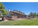 Well-maintained two-story home with brick accents, mature landscaping, and a cozy deck area for relaxation at 9025 Rocky Mountain Ln, Parker, CO 80138