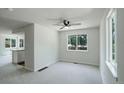 Bright dining area with a ceiling fan and a window to the backyard at 5163 E 123Rd Ct, Thornton, CO 80241