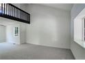 Spacious living room with large windows and carpet flooring at 5163 E 123Rd Ct, Thornton, CO 80241