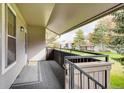 Balcony view showcasing the well-kept grounds and trees, providing a peaceful outdoor space at 7110 S Gaylord St # L7, Centennial, CO 80122