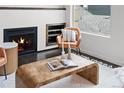 Living room featuring a cozy fireplace, stylish coffee table, and comfortable seating, creating a relaxing atmosphere at 3131 Vallejo St, Denver, CO 80211