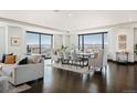 Spacious living area showcasing mountain views from the floor to ceiling windows at 1133 14Th St # 2300, Denver, CO 80202