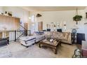 Inviting living room features a comfortable sectional sofa, coffee table and large mirrors at 18890 E Carmel Cir, Aurora, CO 80011