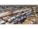 Wide aerial shot of a neighborhood with a variety of homes and snow-covered lawns at 4150 E 117Th Ave, Thornton, CO 80233