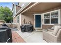 Inviting front porch with seating, a grill, and a view of the entrance at 13275 Holly St # B, Thornton, CO 80241