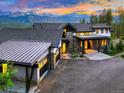 Mountain retreat with three-car garage, stone accents, and a grand entrance, perfect for enjoying scenic views at 2300 Boreas Pass Rd, Breckenridge, CO 80424