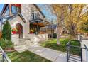 Beautiful home showcasing a landscaped yard, inviting front entrance and stylish architectural design at 536 S Vine St, Denver, CO 80209