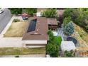 Aerial view of backyard featuring a back porch, landscaping, trampoline and above ground pool at 1261 Eagle St, Aurora, CO 80011